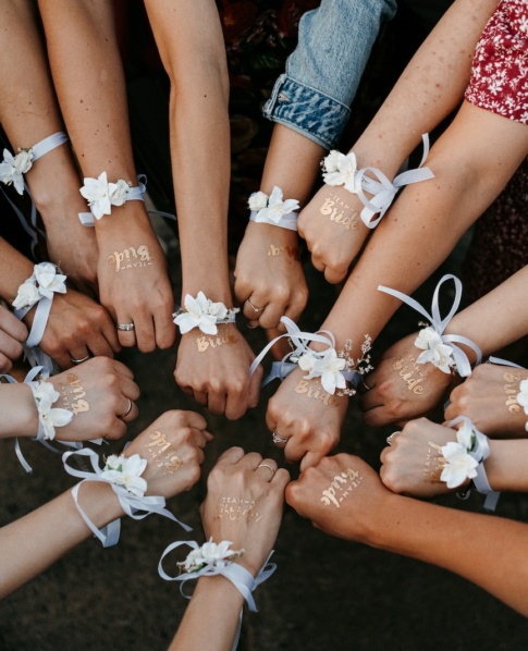 Women With Ribbon Bracelets for Bachelorette Party