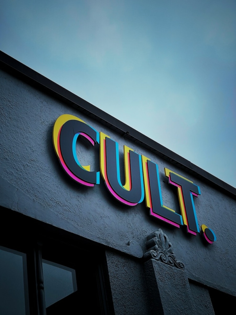 a neon sign on the side of a building