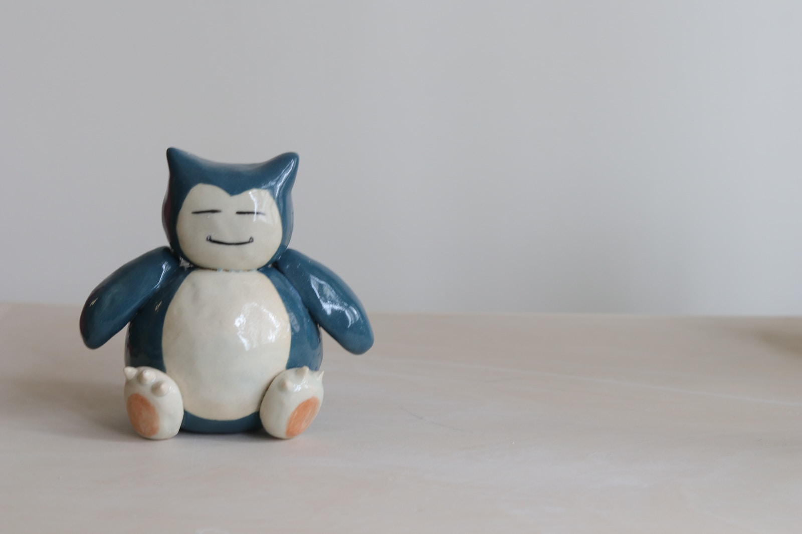 white and blue cat figurine